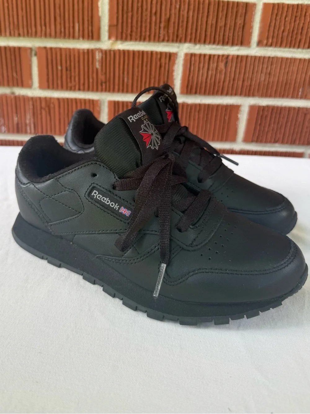 Reebok Kids All‑Black Classic Sneaker